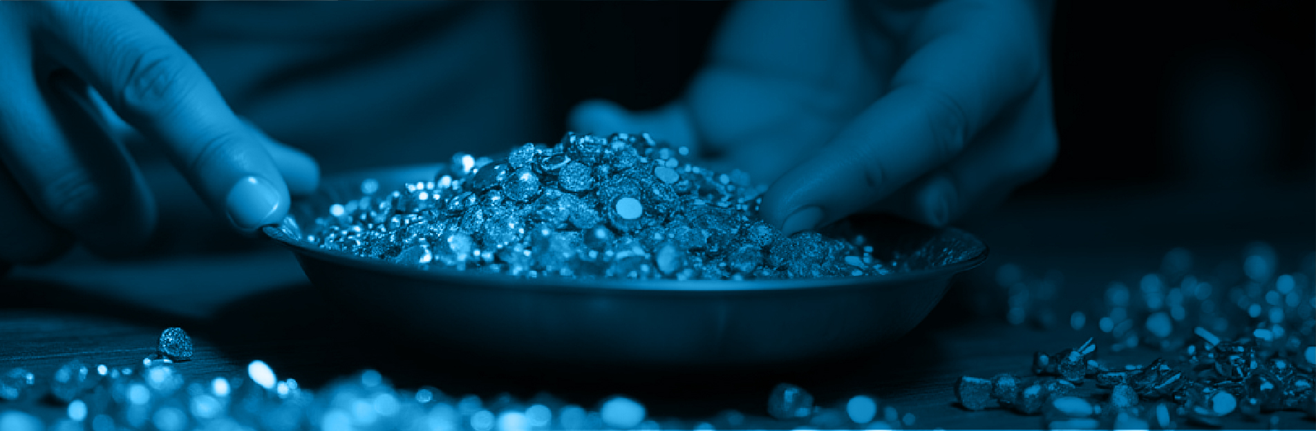 Jeweler weighing gold